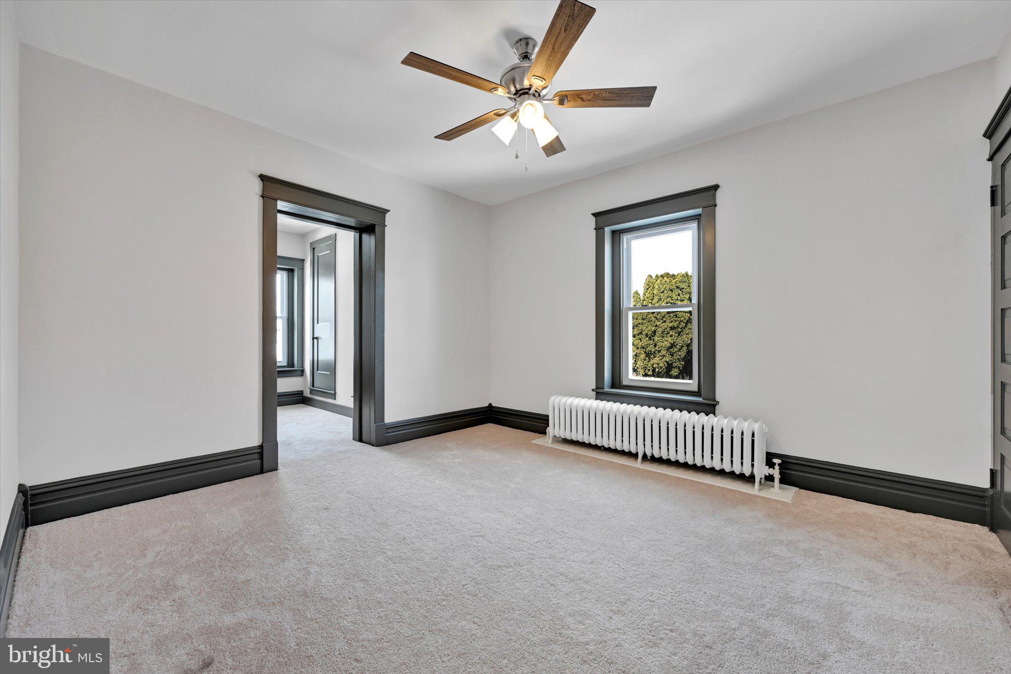 32 North Main Street Topton, PA 19562 - Photo 24 of 36 an empty room with windows and fan
