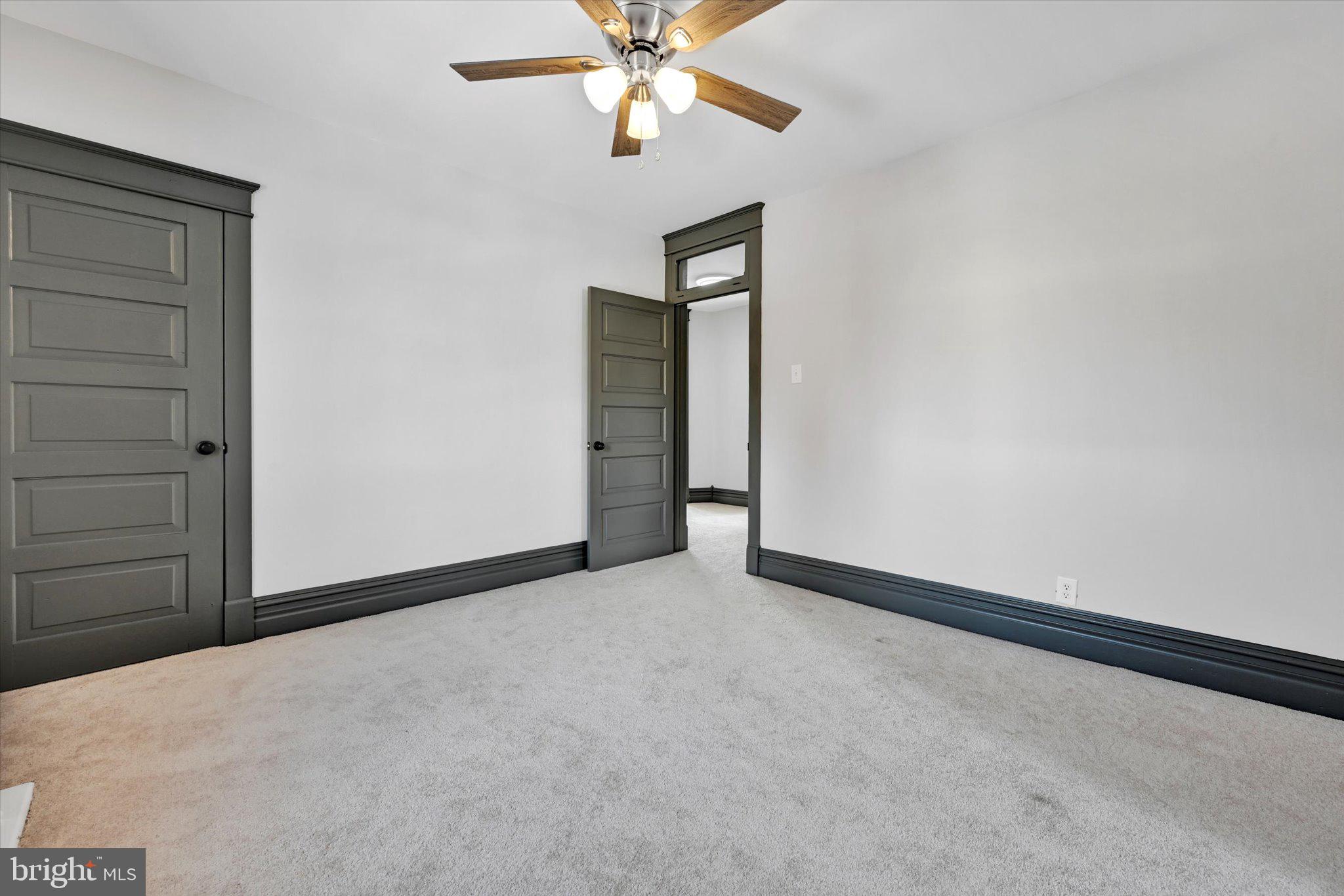 32 North Main Street Topton, PA 19562 - Photo 25 of 36 an empty room with closet and a chandelier fan