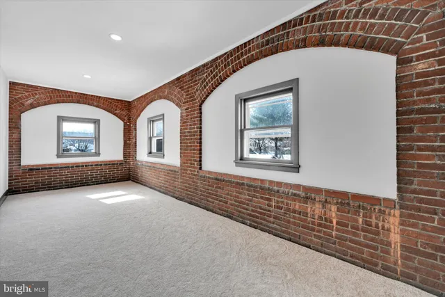 a view of a hallway with windows