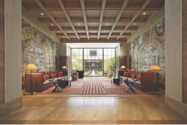 a living room with furniture ceiling fan and a rug