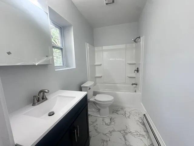 a bathroom with a sink toilet and vanity