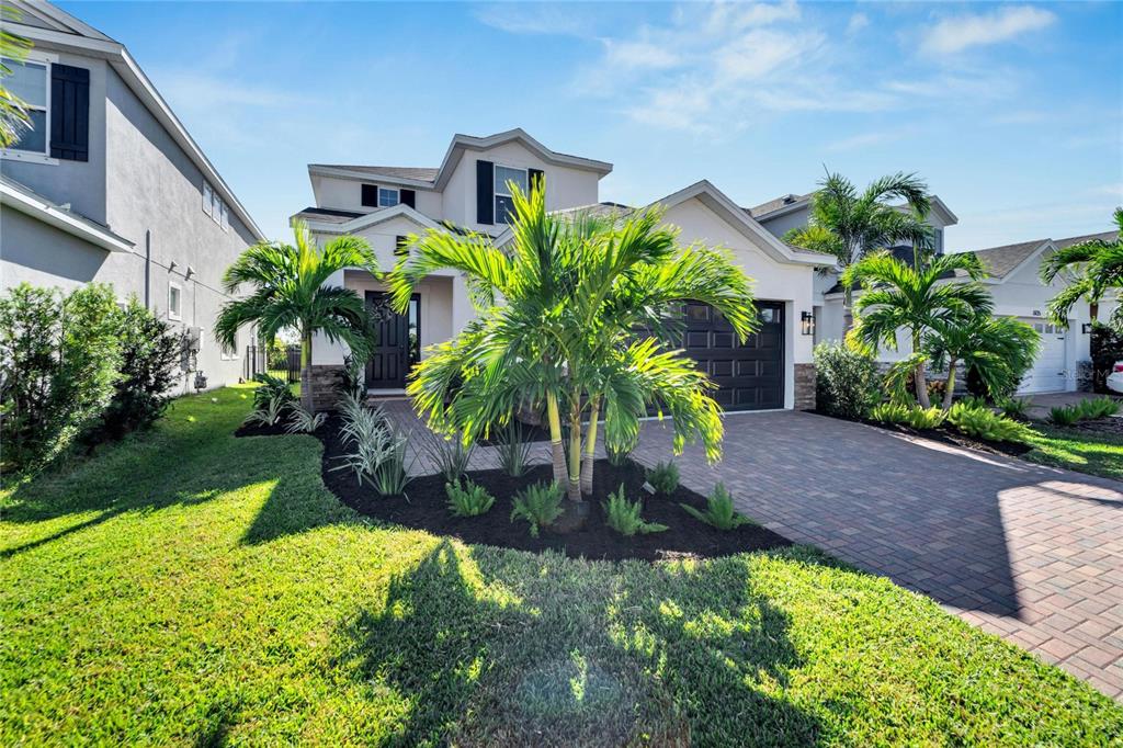 a front view of a house with a yard