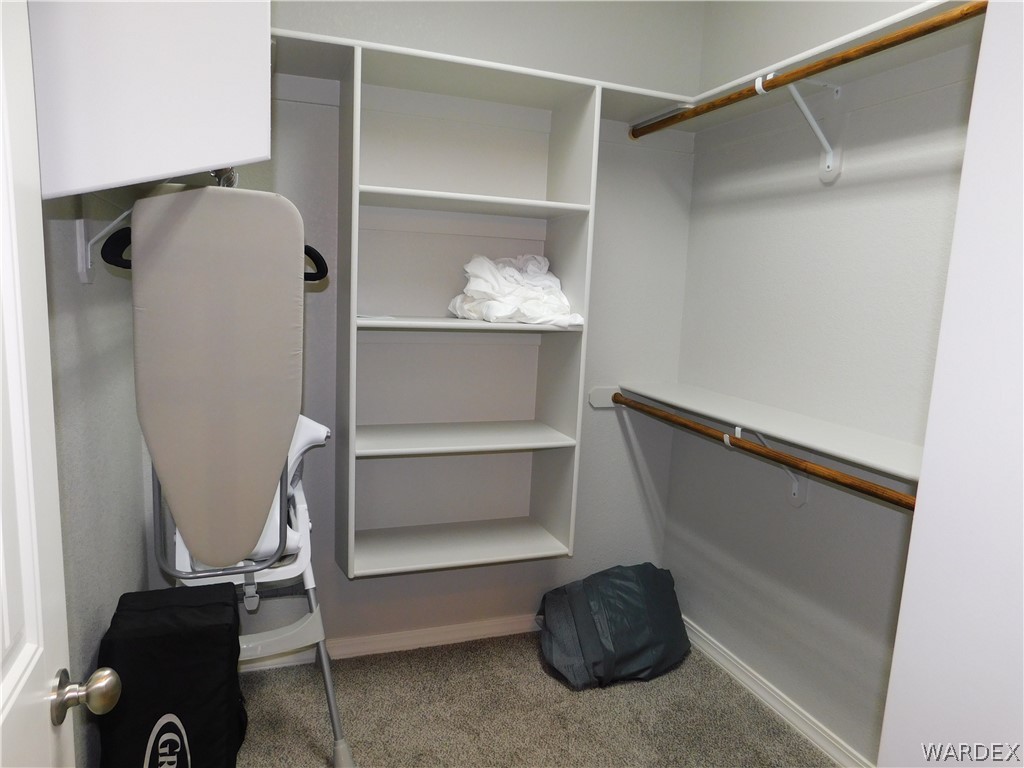 3370 South Ridge Avenue Bullhead City, AZ 86429 - Photo 41 of 56 a room with a closet and wooden floor