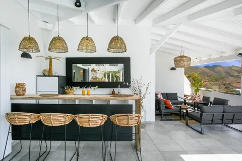 a view of living room kitchen with furniture and window