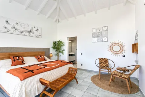 a bedroom with a bed and lamp