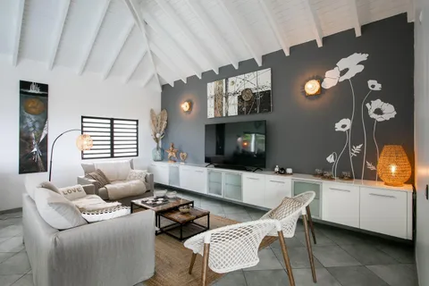 a living room with furniture and a flat screen tv