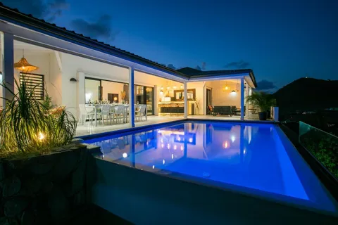 a view of swimming pool with a chair and tables