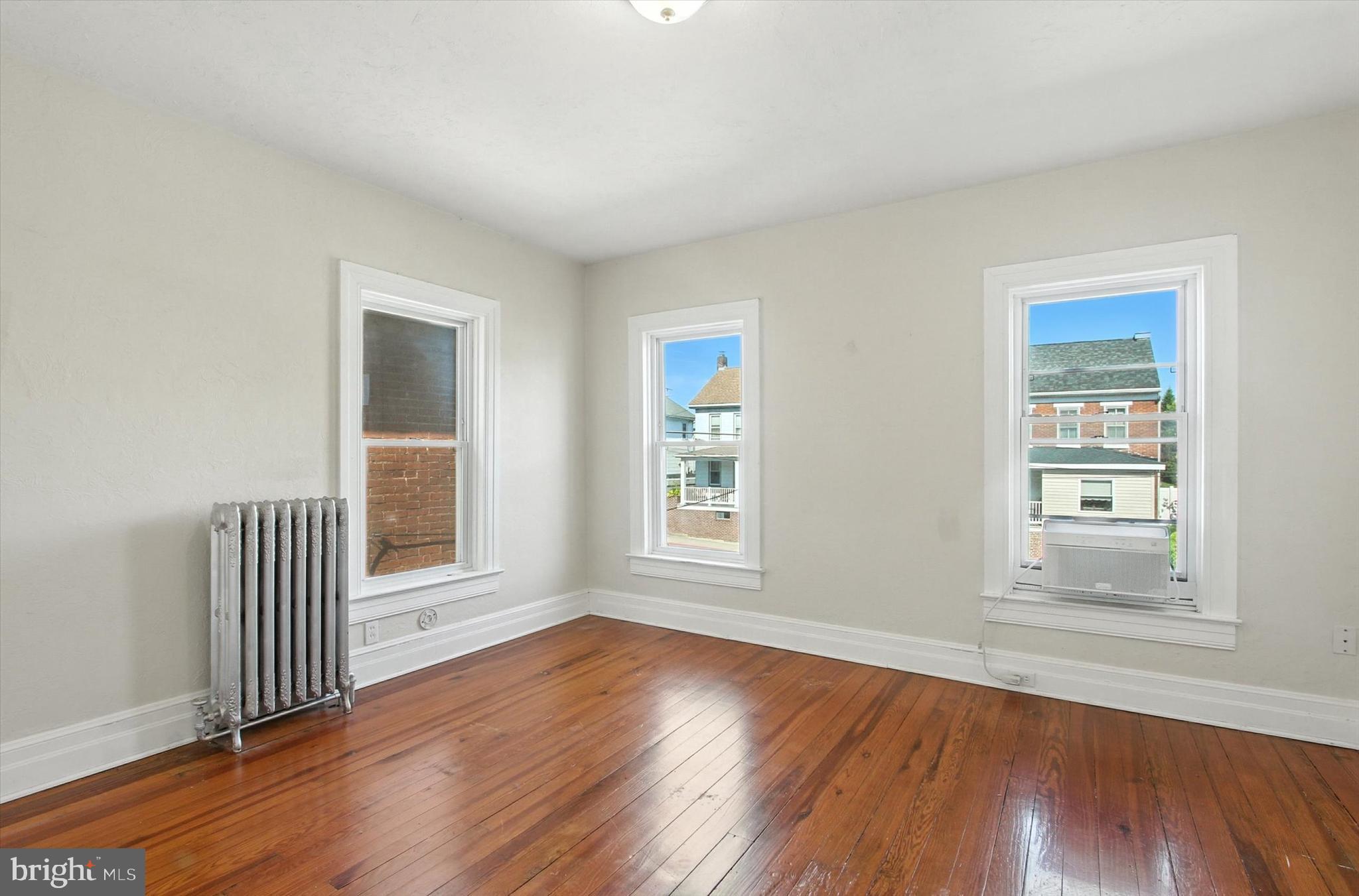 46 North Main Street Spring Grove, PA 17362 - Photo 13 of 25 a view of empty room with wooden floor and fan