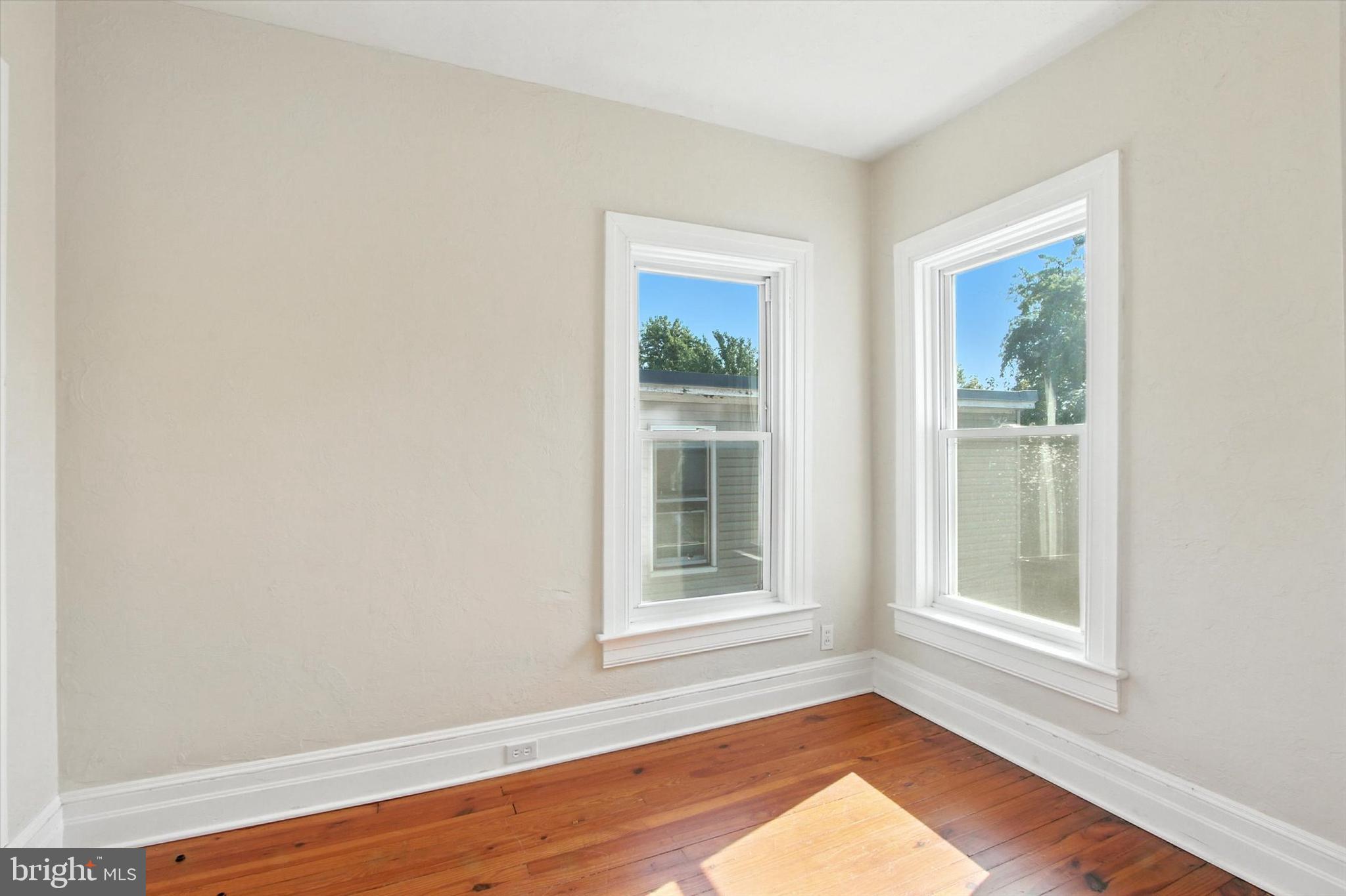 46 North Main Street Spring Grove, PA 17362 - Photo 16 of 25 a view of an empty room with wooden floor and a window