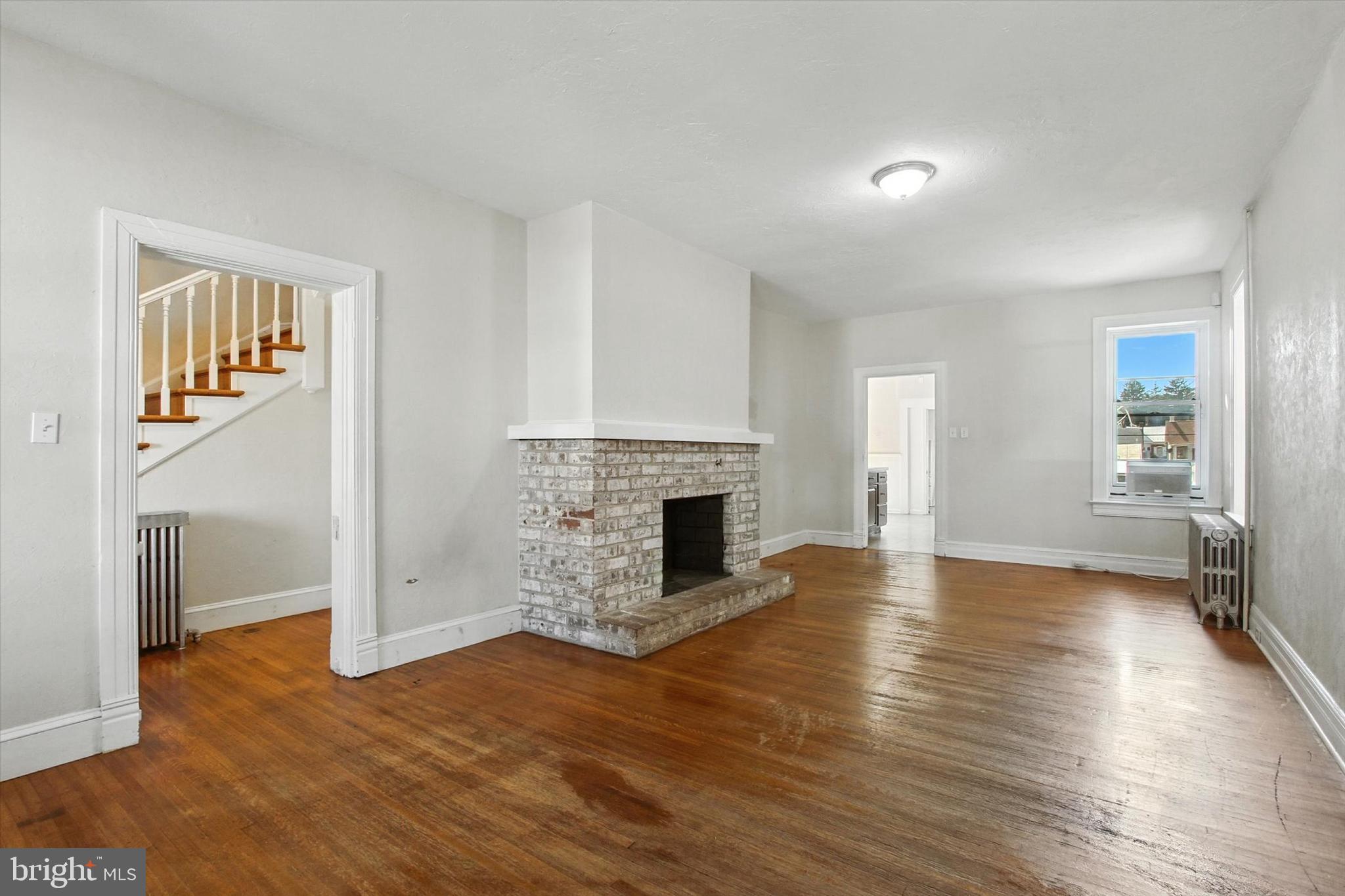 46 North Main Street Spring Grove, PA 17362 - Photo 3 of 25 a view of a livingroom with wooden floor and a fireplace