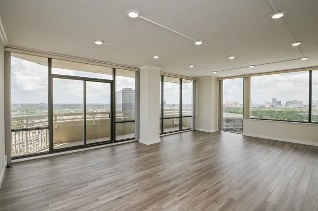 a view of an entryway with wooden floor