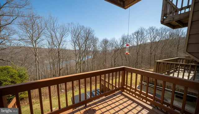 a view of balcony with wooden floor