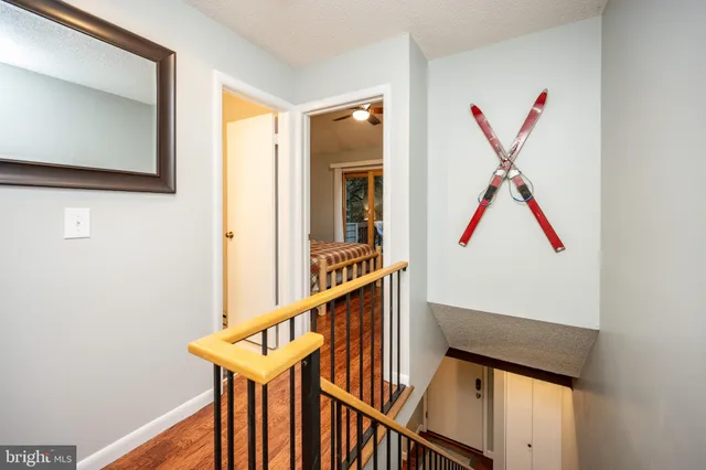 a view of an entryway with wooden floor