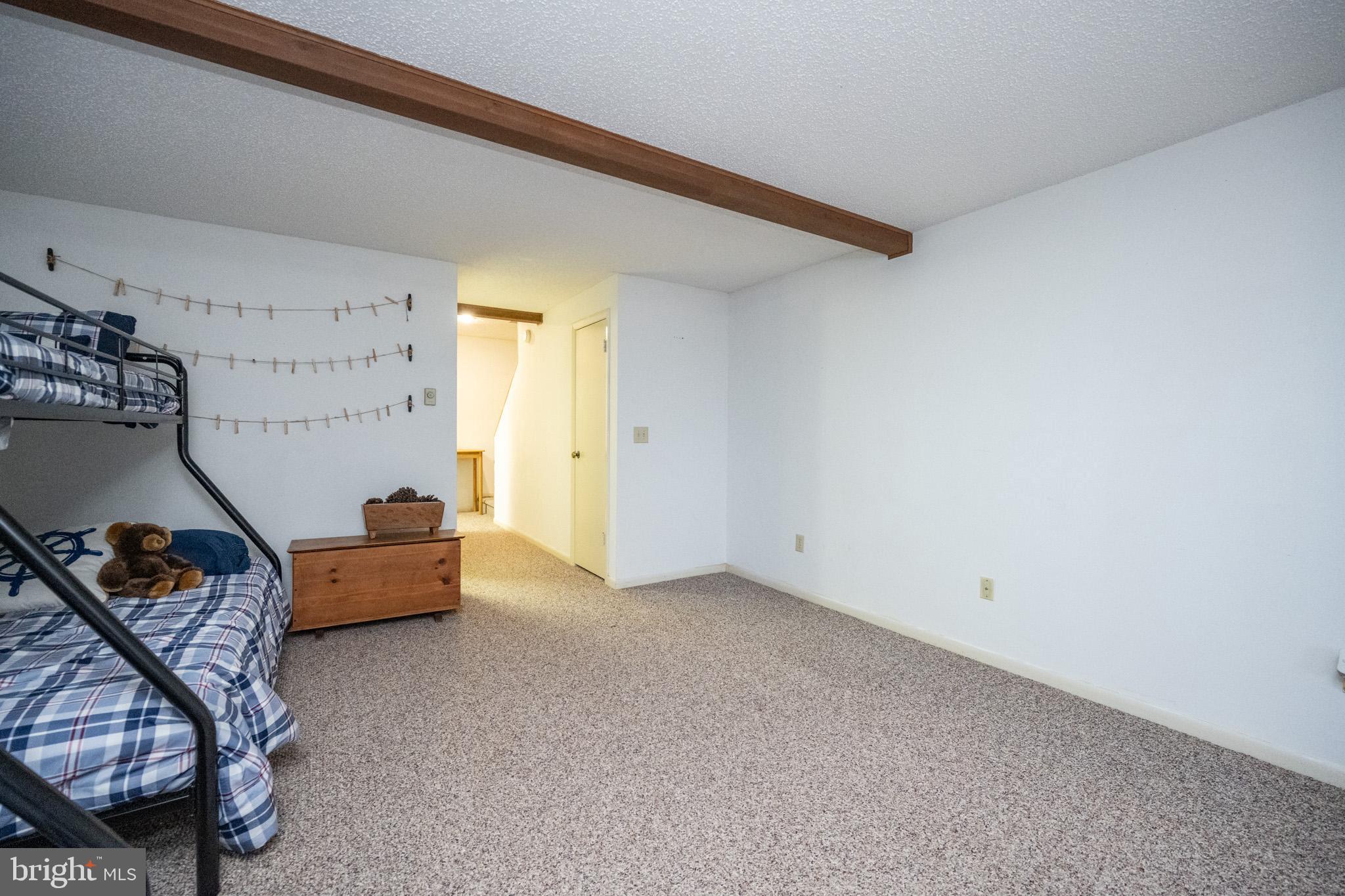 48 Bright Passage, Unit 5B McHenry, MD 21541 - Photo 28 of 56 a living room with furniture and a window
