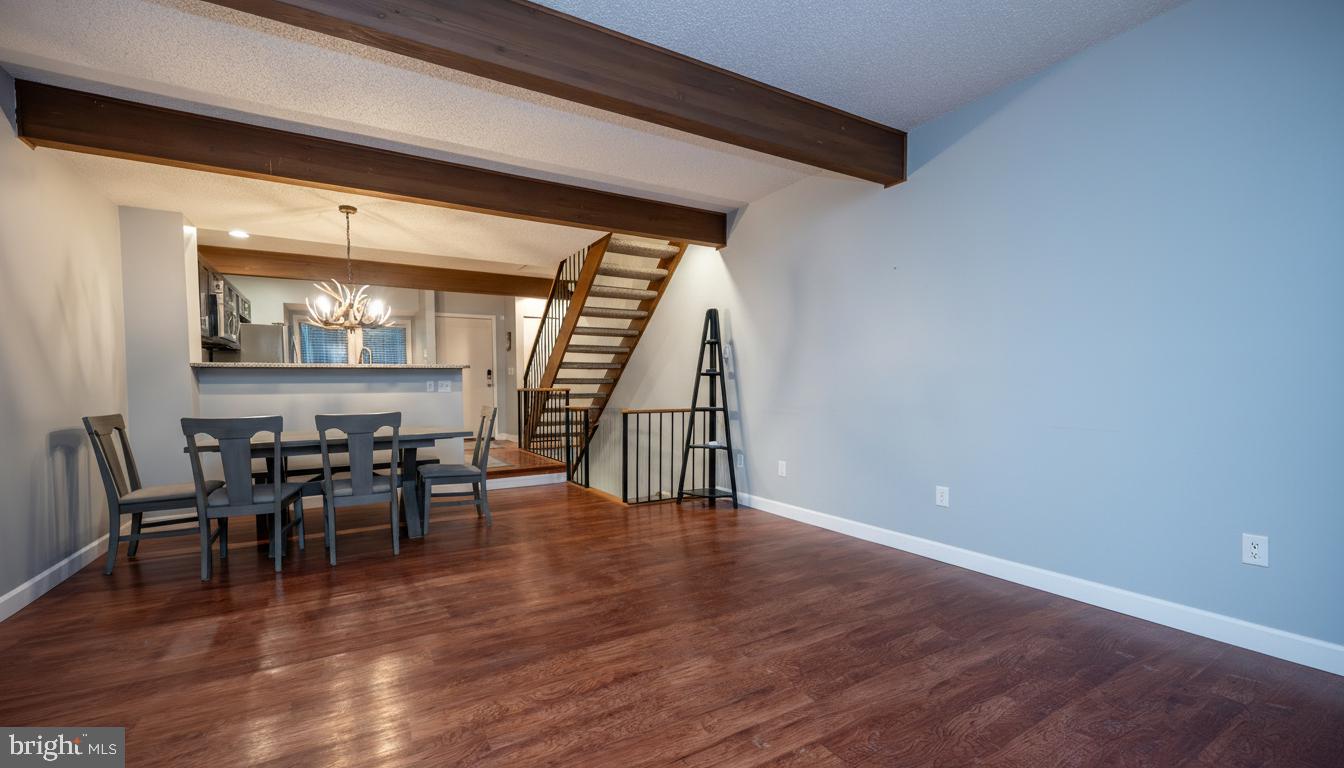 48 Bright Passage, Unit 5B McHenry, MD 21541 - Photo 9 of 56 a view of a dining room with furniture window and wooden floor