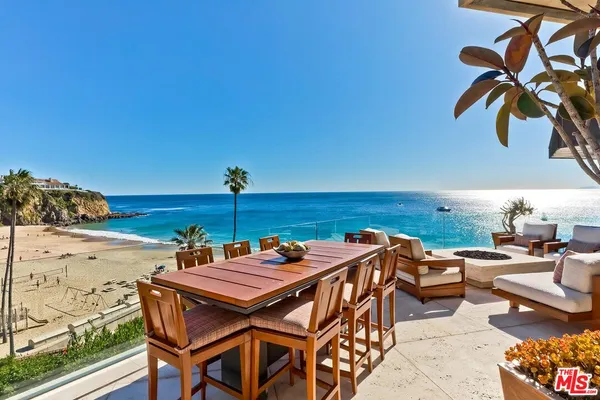 an outdoor space with furniture and umbrella