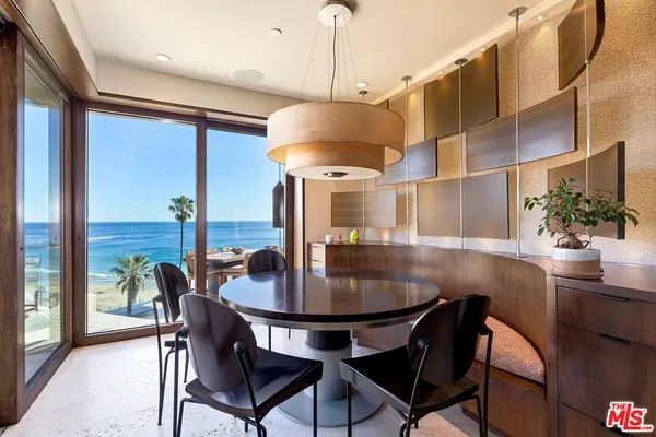 a dining room with furniture and chandelier