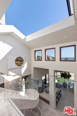 a dining room with table and chairs
