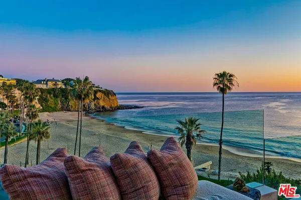 a view of a two chairs in the patio