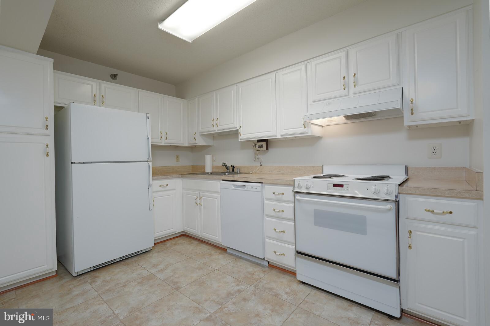 14800 Pennfield Circle, Unit 202 Silver Spring, MD 20906 - Photo 10 of 30 Spacious kitchen with white cabinets
