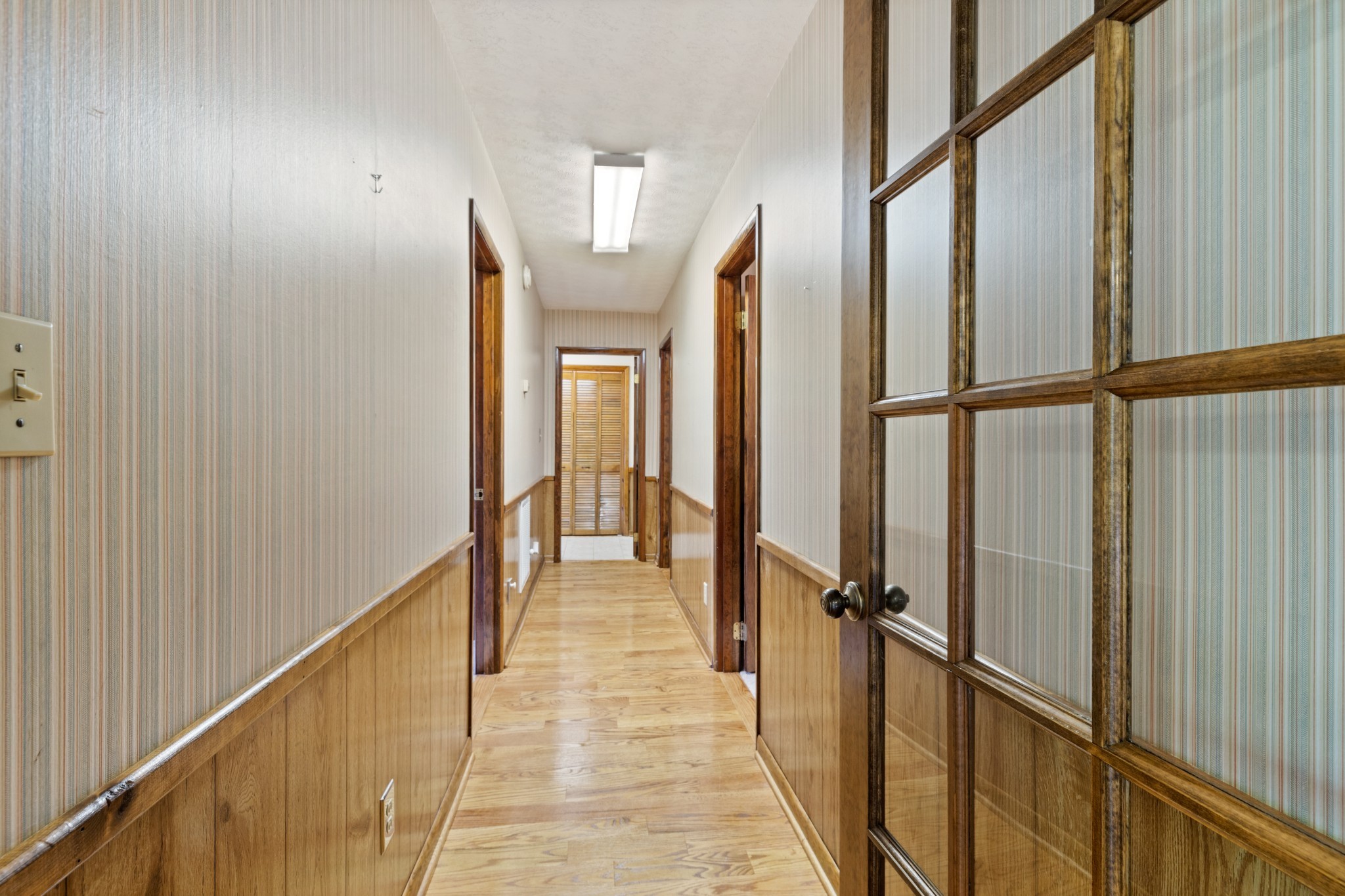 111 Rae Lane Dickson, TN 37055 - Photo 24 of 39 View down the hallway of the upstairs living space.