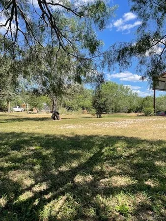 a view of a yard with green space