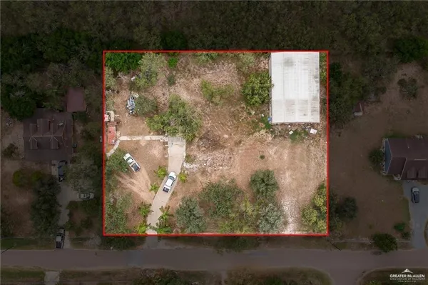 an aerial view of a residential houses with outdoor space