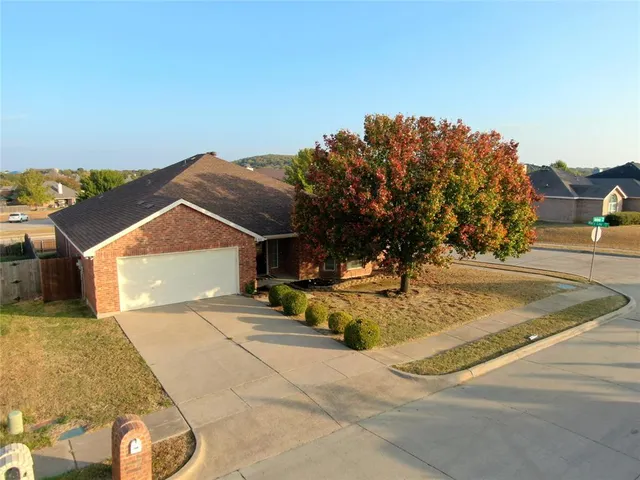 a view of a house with basketball court