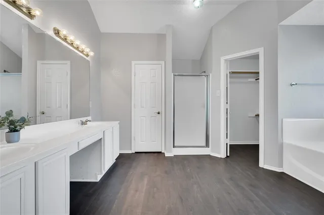 a view of an entryway with wooden floor