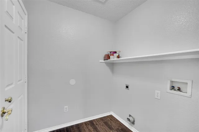 a view of a swimming pool with a lawn chairs and a yard