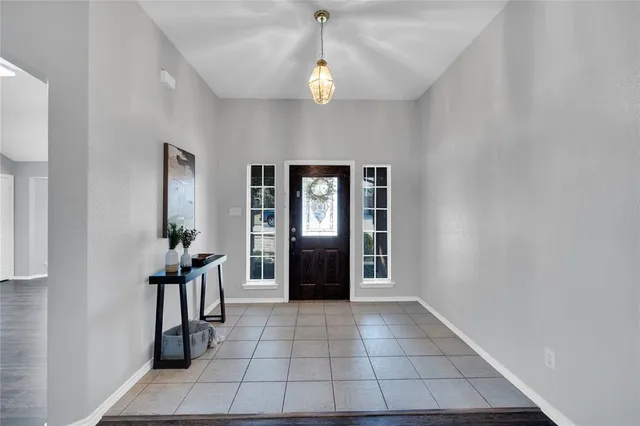 a view of an entryway with a chandelier