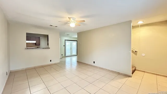 a view of an empty room with a bathroom
