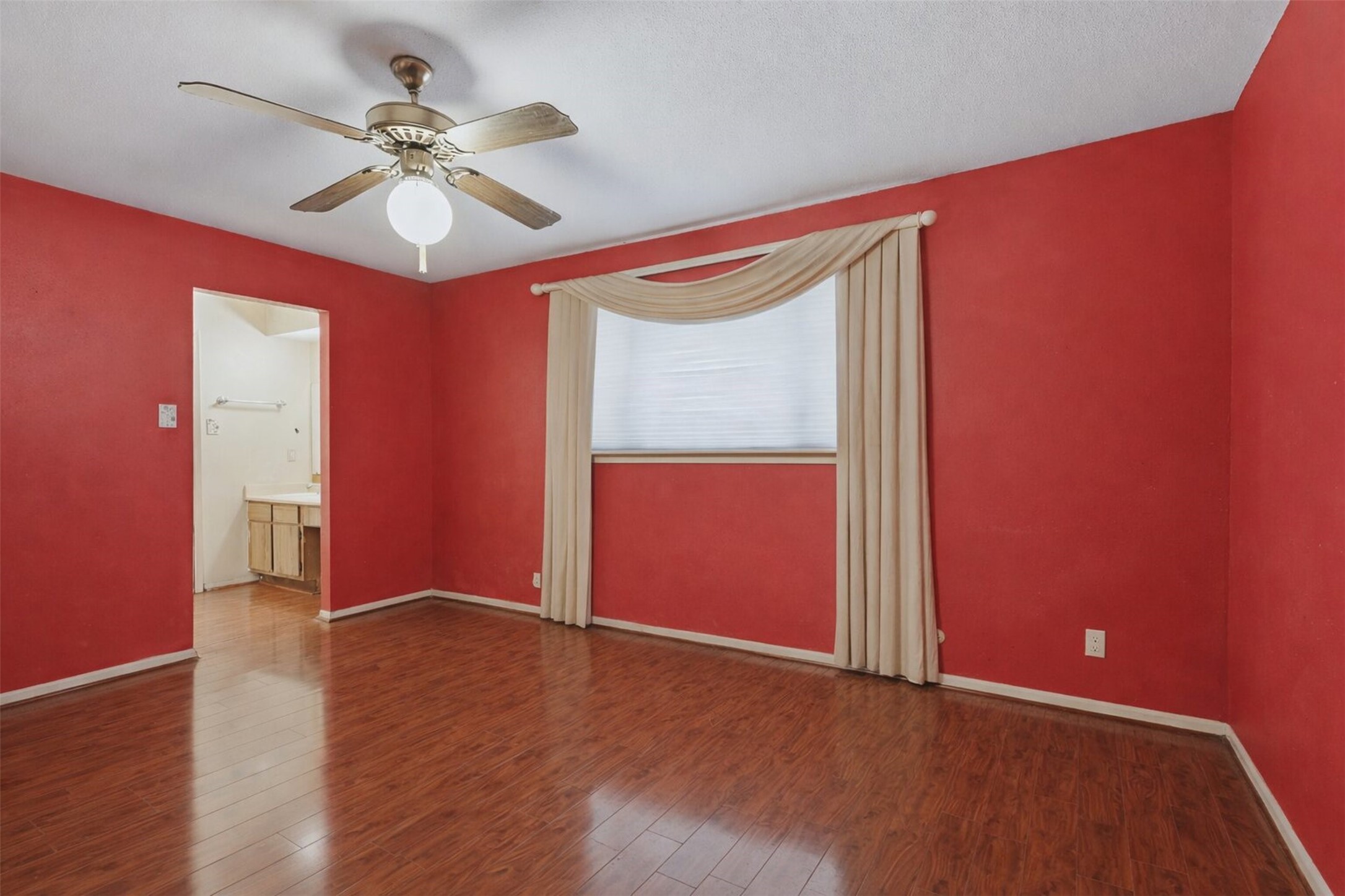 17011 Kings Walk Lane Houston, TX 77070 - Photo 15 of 50 a view of an empty room with a window and wooden floor