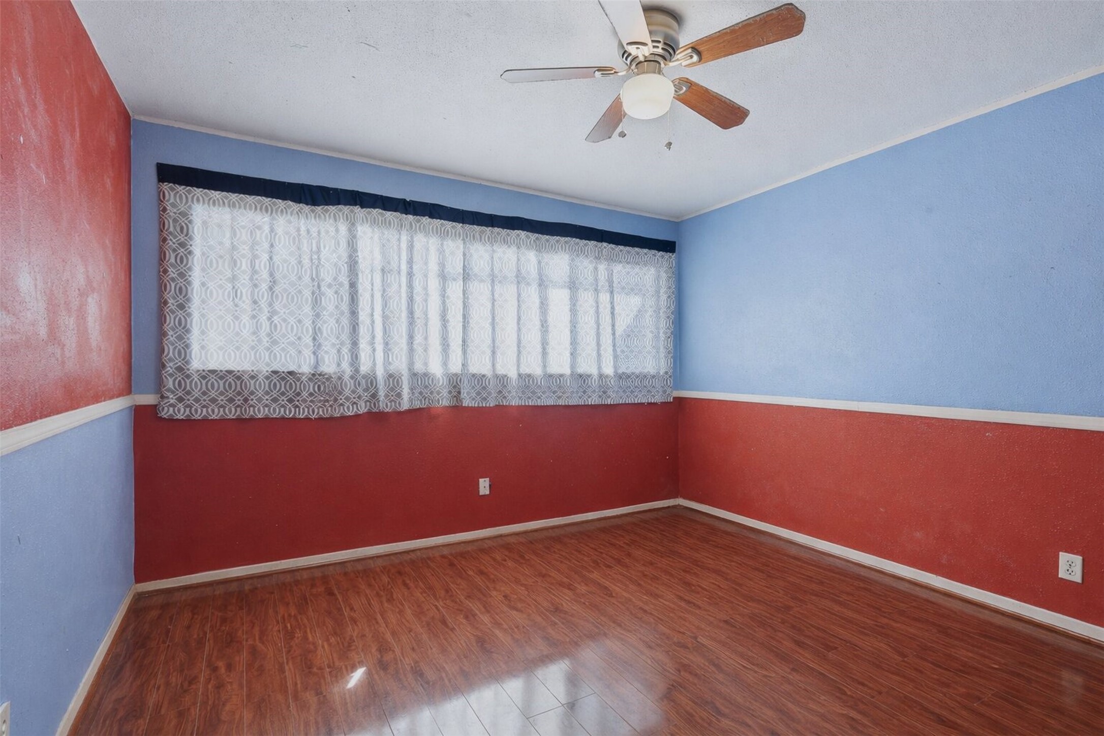 17011 Kings Walk Lane Houston, TX 77070 - Photo 23 of 50 an empty room with wooden floor and windows