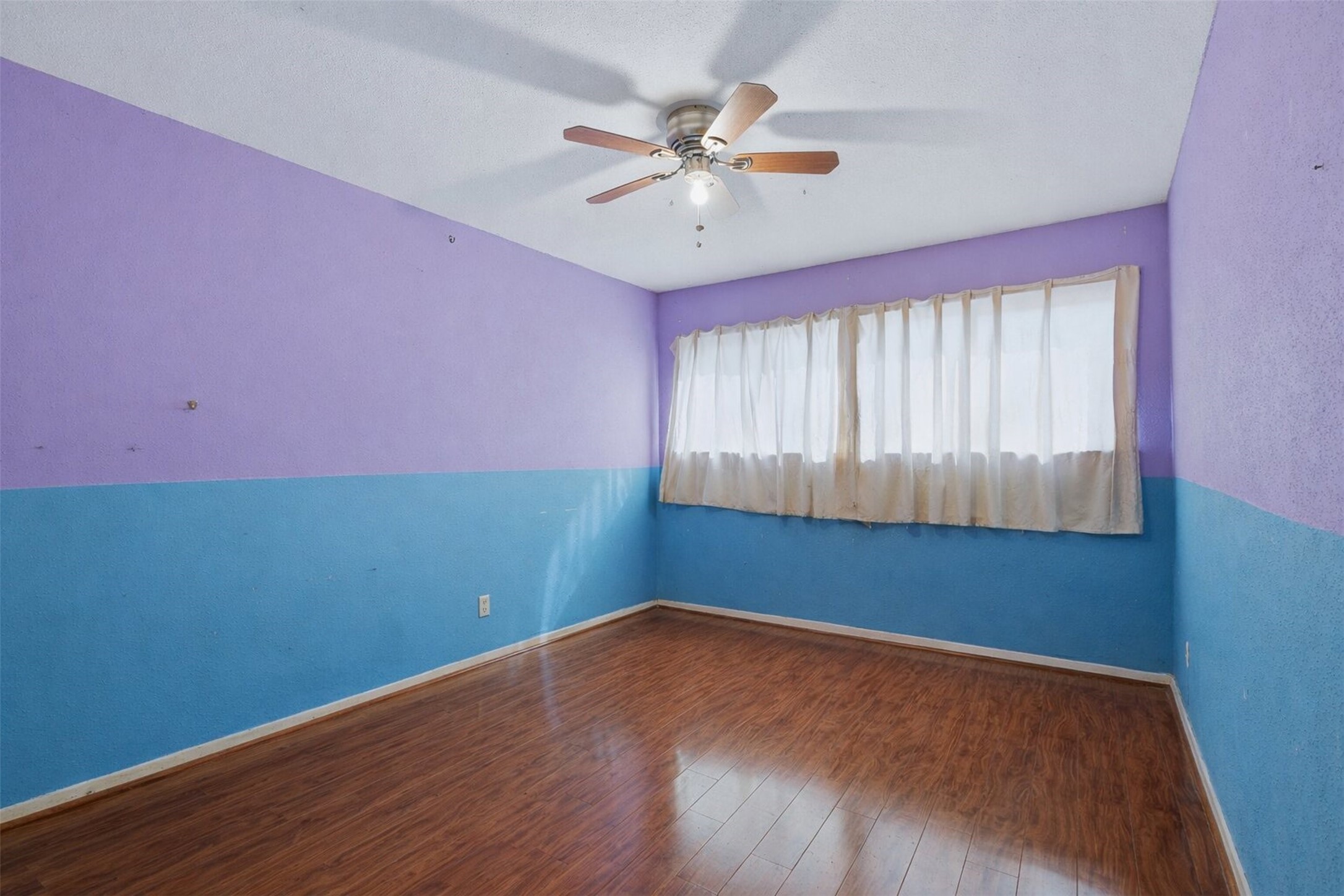 17011 Kings Walk Lane Houston, TX 77070 - Photo 26 of 50 a view of an empty room with wooden floor and a window