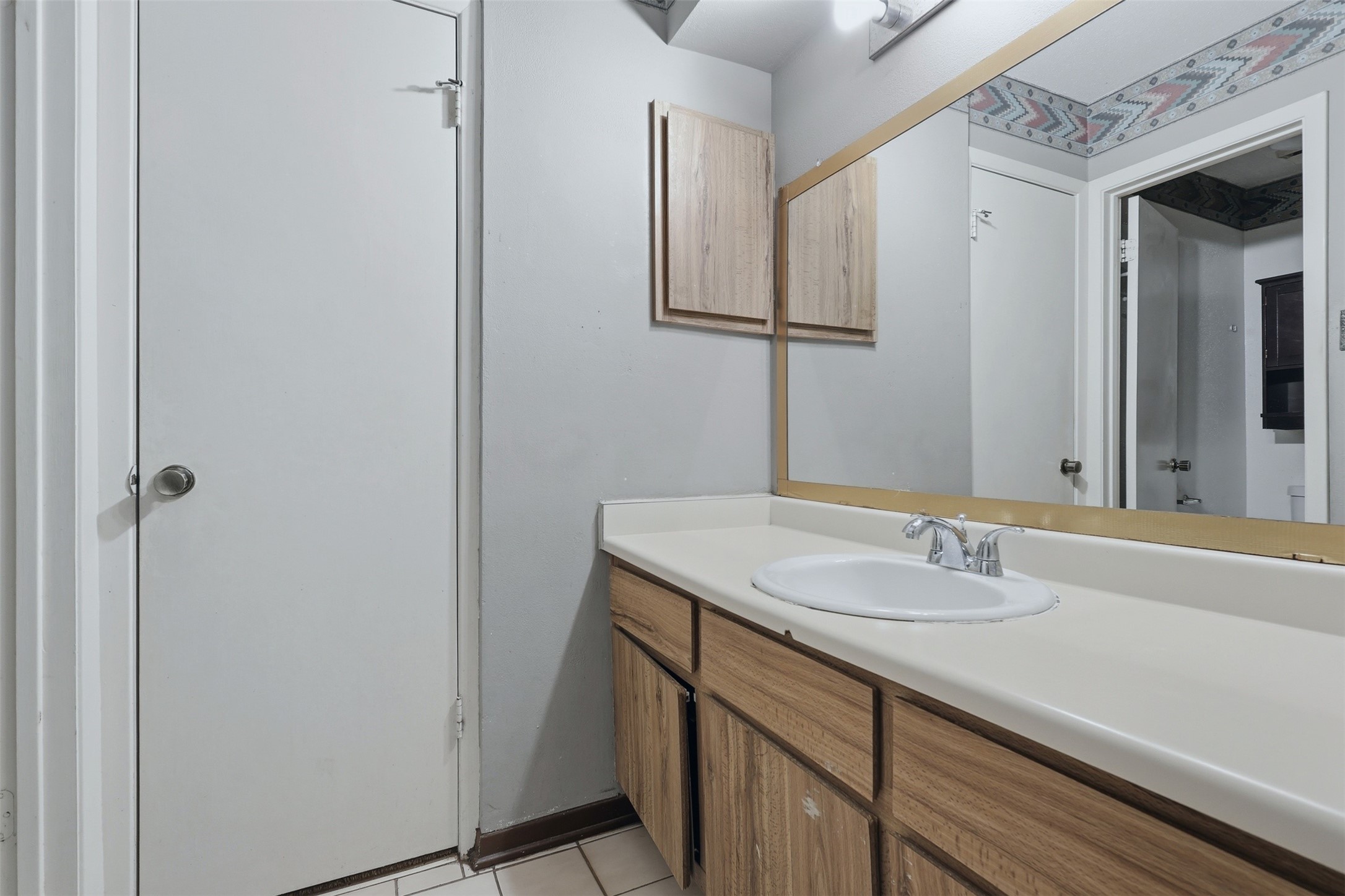 17011 Kings Walk Lane Houston, TX 77070 - Photo 29 of 50 a bathroom with a sink and a mirror