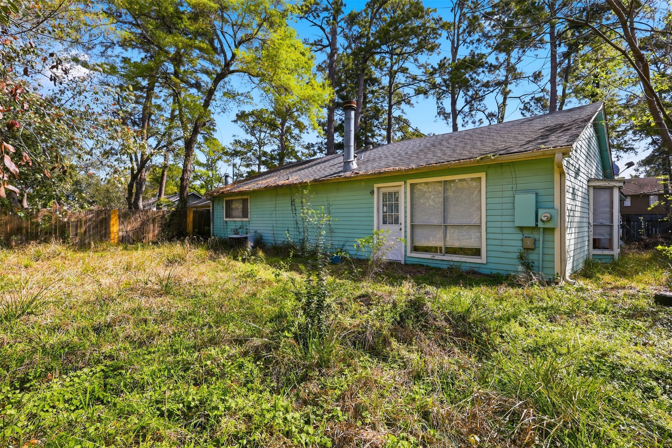 17011 Kings Walk Lane Houston, TX 77070 - Photo 33 of 50 Large backyard offering a private setting with mature trees and plenty of potential.