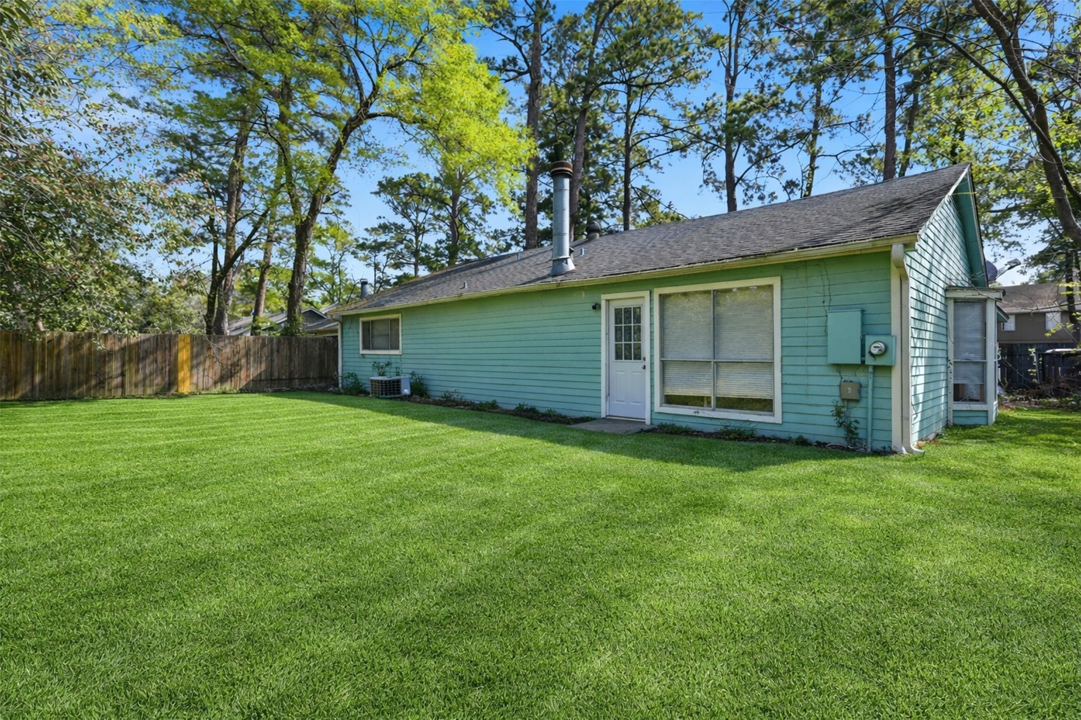 17011 Kings Walk Lane Houston, TX 77070 - Photo 40 of 50 a view of a backyard with a large tree