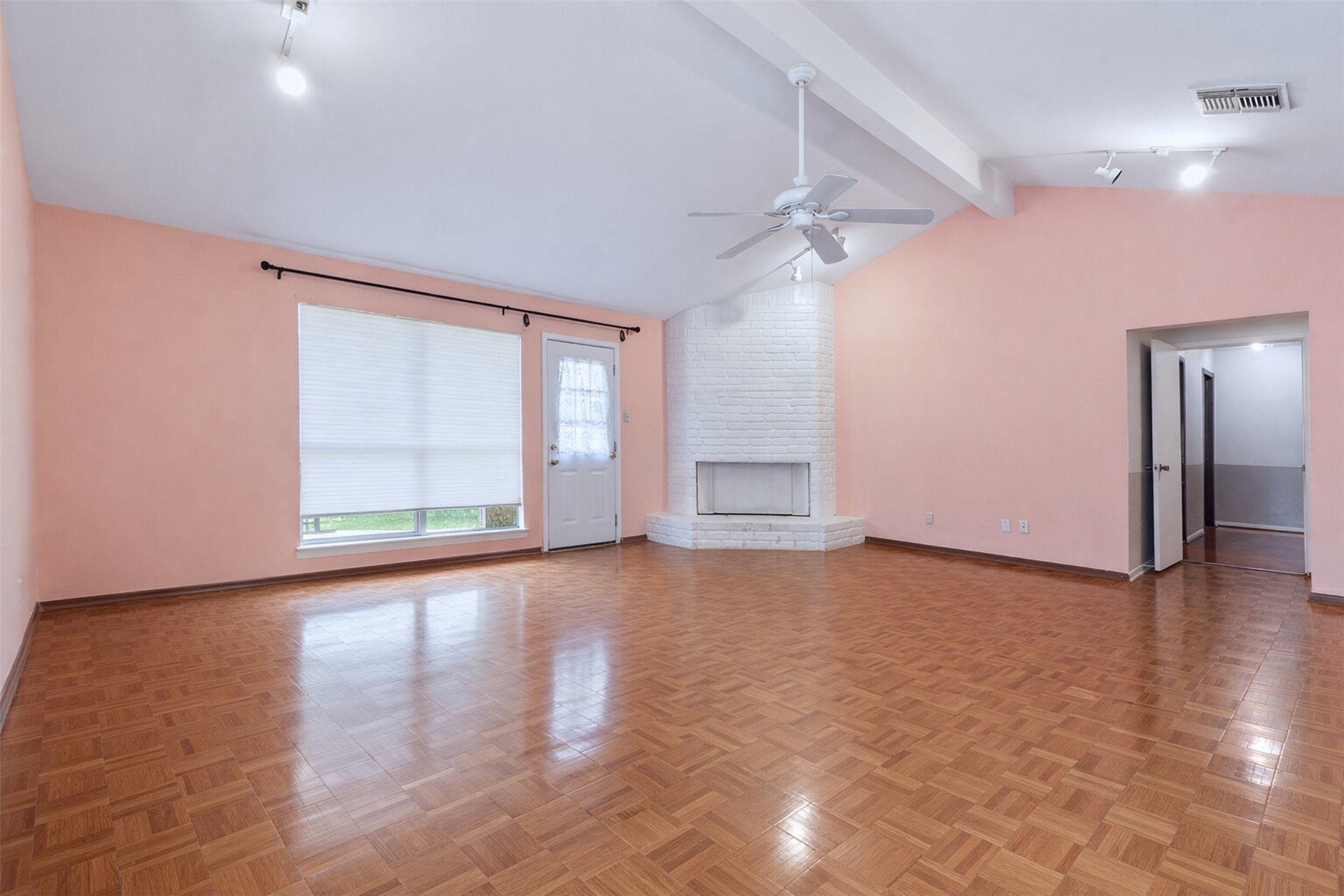 17011 Kings Walk Lane Houston, TX 77070 - Photo 6 of 50 a view of an empty room with a window and wooden floor