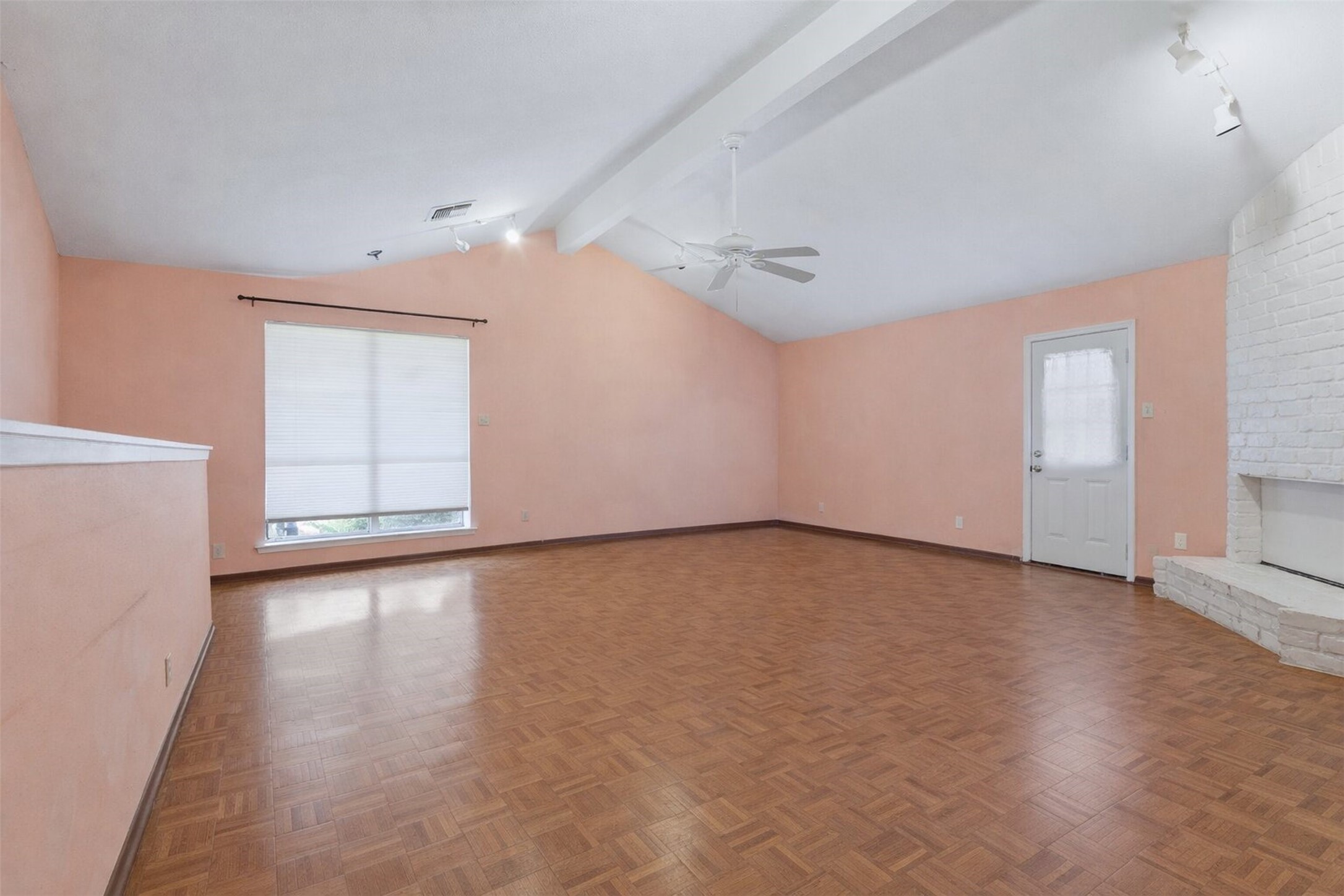17011 Kings Walk Lane Houston, TX 77070 - Photo 7 of 50 a view of an empty room with wooden floor and a window