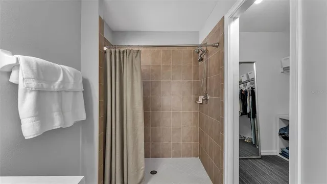 a bathroom with a shower and a sink