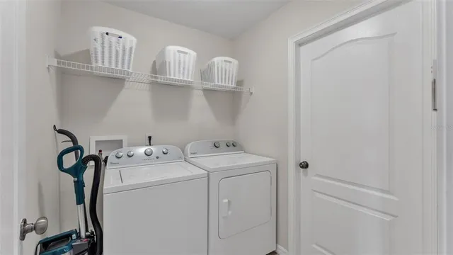 a utility room with dryer and washer