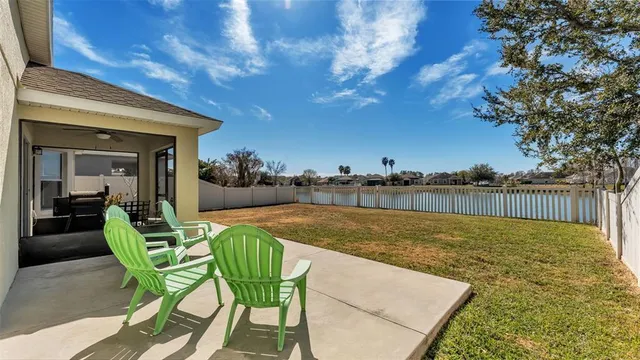 a view of a chairs and table in the patio