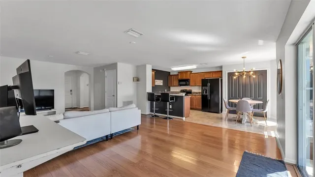 a living room with furniture flat screen tv and outdoor view