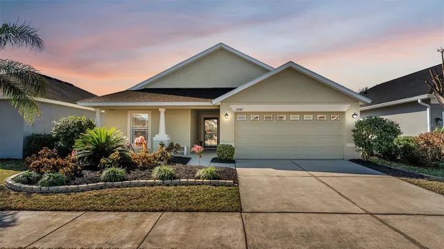 front view of house with potted plants