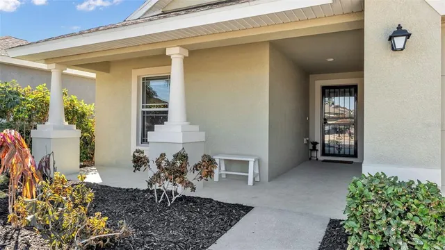 a view of a porch with a table and chair