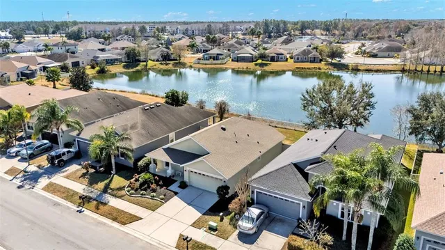 an aerial view of a house with lake view