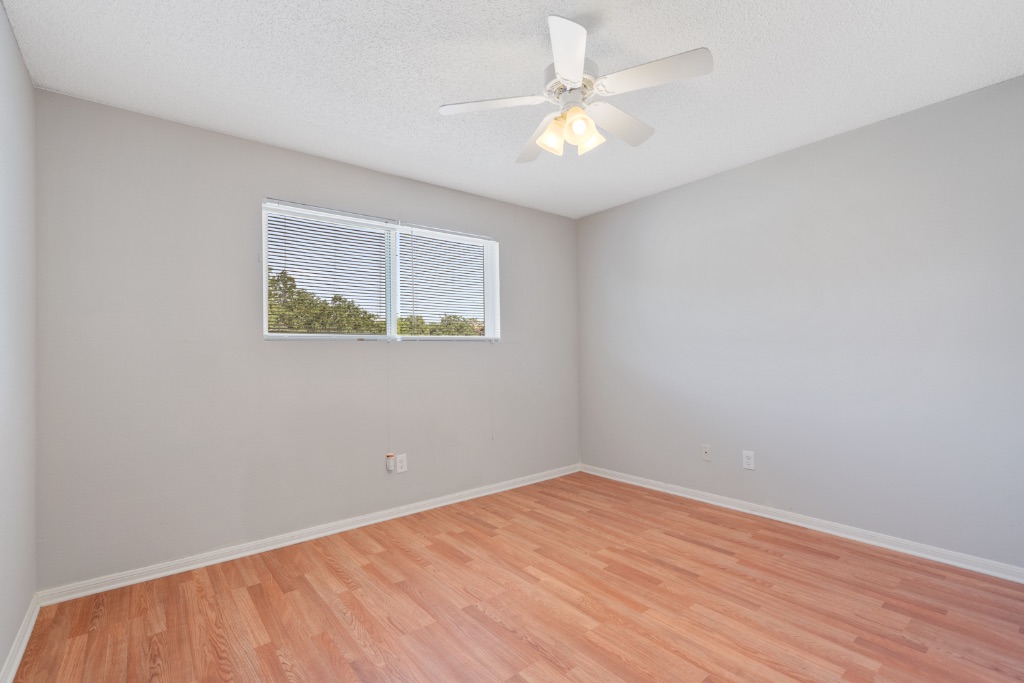 8703 Schick Road, Unit A Austin, TX 78729 - Photo 12 of 21 an empty room with a window