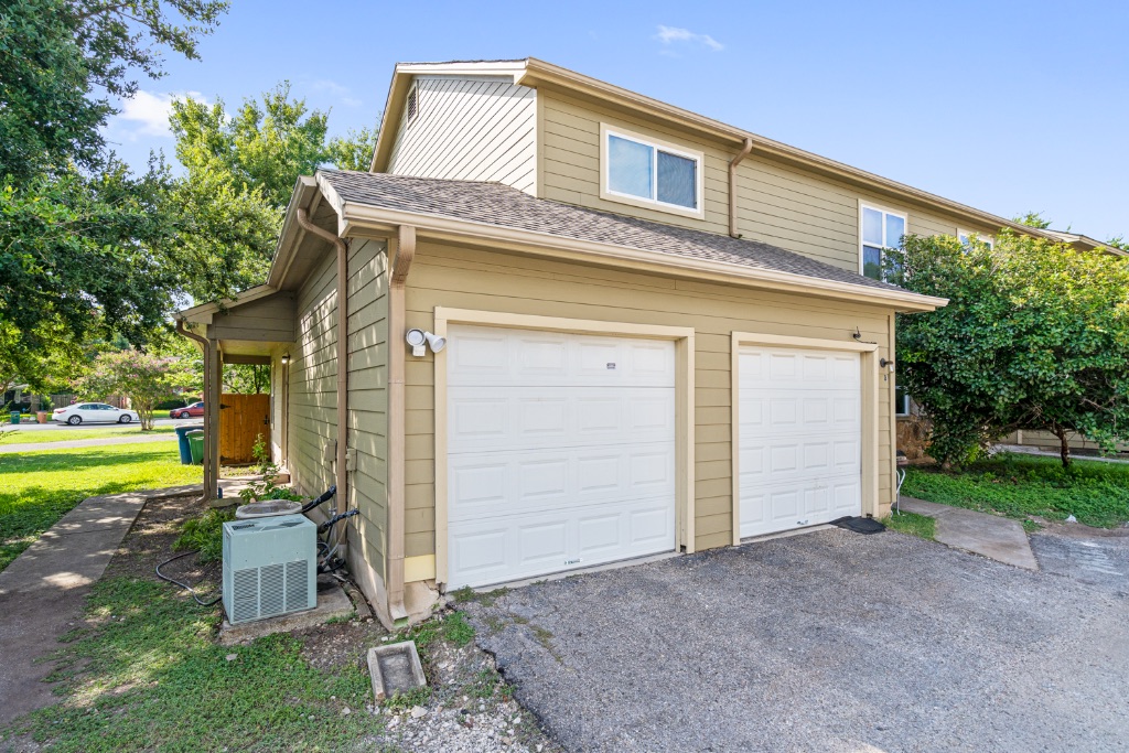 8703 Schick Road, Unit A Austin, TX 78729 - Photo 18 of 21 a front view of a house with a yard
