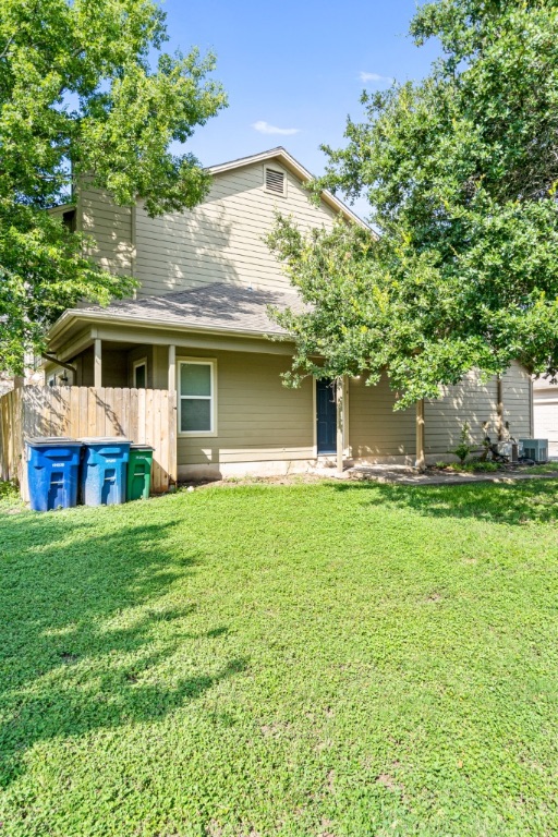 8703 Schick Road, Unit A Austin, TX 78729 - Photo 19 of 21 a front view of house with yard and green space